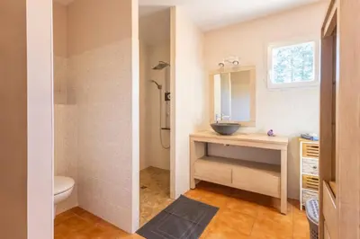 a bathroom with a sink and a shower and a toilet at Villa sur Domaine Aix - Piscine & Tennis - Wagner in Aix-en-Provence