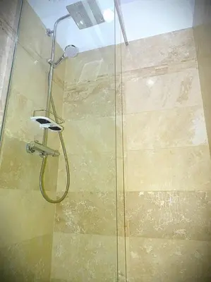 a shower with a glass door in a bathroom at AQUA TERRA-Studio Cozy-Aix Historic Center- SMART TV-WIFI in Aix-en-Provence