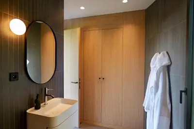 a bathroom with a sink and a mirror at Haras de Castellane in Pertuis