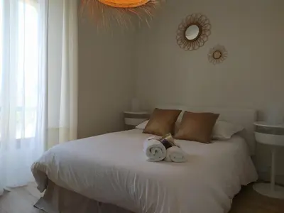 a bedroom with a bed with two stuffed animals on it at Niché au cœur de la Provence - VERNEGUES in Vernègues