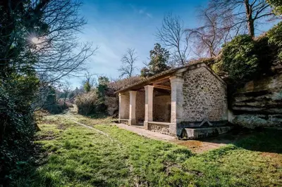 an old stone building in a grassy field at Niché au cœur de la Provence - VERNEGUES in Vernègues