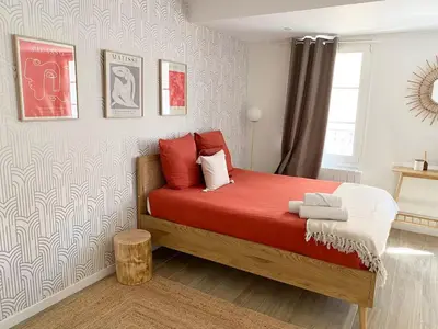 a living room with a couch and a table at La Rotonde by Rentalaix in Aix-en-Provence