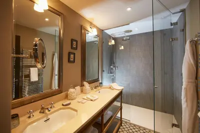 a bathroom with a sink and a shower at Domaine de Fontenille - Fontenille Collection in Lauris