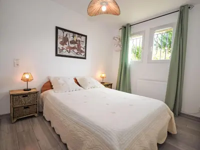 a bedroom with a white bed and two windows at Apartment Les Santons by Interhome in Peypin-dʼAigues