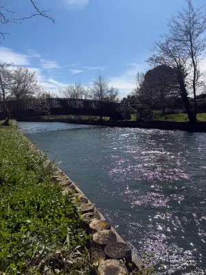 a picture of a house next to a river at Le Roly's in Saint-Saturnin-lès-Avignon