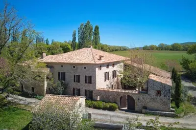 an aerial view of a large stone house at Mas de Thésée Piscine & 12 ha privés in Reillanne