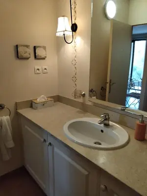 a bathroom with a sink and a mirror at Golf de saumane in Saumane-de-Vaucluse