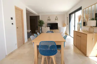 a kitchen and dining room with a wooden table and chairs at Villa with heated pool and Ventoux View in Pernes in Pernes-les-Fontaines