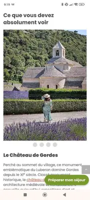 a person standing in front of a garden with purple flowers at Petite maison de charme in LʼIsle-sur-la-Sorgue