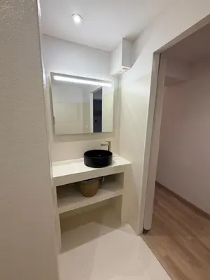 a bathroom with a sink and a mirror at Le Clos d'AIX studio 1 in Aix-en-Provence