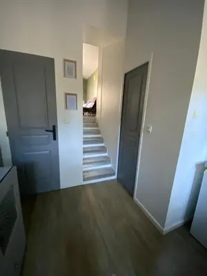 a hallway with two doors and a stairway at Studio indépendant dans propriété campagne Aixoise terrasse et piscine période estivale in Aix-en-Provence