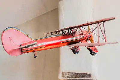 a red plane hanging from a wall at Urban loft with terrace downtown in Aix-en-Provence