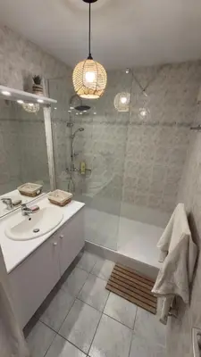 a bathroom with a shower and a sink and a tub at Magnifique T2 Aix-en-Provence in Aix-en-Provence