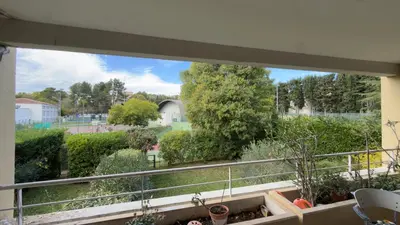 a balcony with a view of a garden at Magnifique T2 Aix-en-Provence in Aix-en-Provence