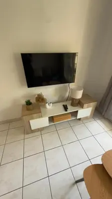 a living room with a large flat screen tv at Magnifique T2 Aix-en-Provence in Aix-en-Provence