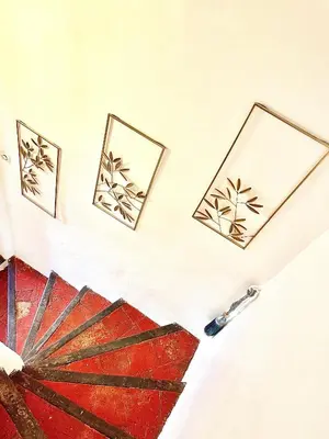 a room with three pictures on the wall at L'escalier gaucher in Lambesc