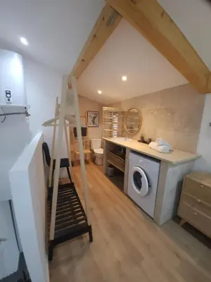 a laundry room with a washing machine and a staircase at Duplex Design - Clim - Parking privé - Wifi - by CommeChezSoi in Vedène