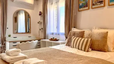 a bedroom with a large bed and a mirror at Modern Villa With Views Of Gordes in Gordes