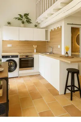 a kitchen with white cabinets and a sink and a dishwasher at Le Nily Provence, T2 cosy rénové avec Clim, Extérieur et Parking in Sainte-Tulle