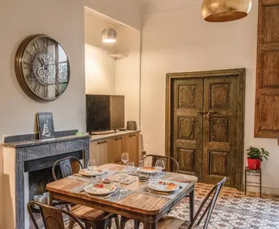 a bathroom with a tub and a sink at La maison du Roy in Aix-en-Provence