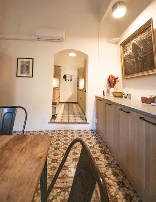 a bedroom with a bed and a book shelf at La maison du Roy in Aix-en-Provence