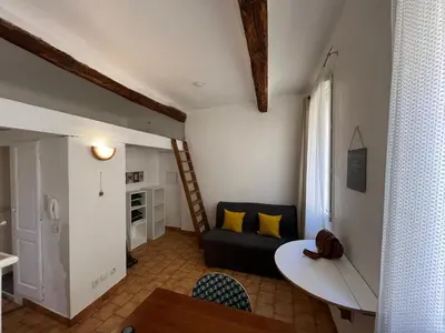 a living room with a couch and a table at Casa Centrale in Aix-en-Provence