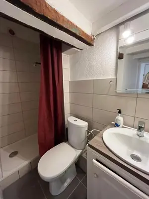 a bathroom with a white toilet and a sink at Casa Centrale in Aix-en-Provence