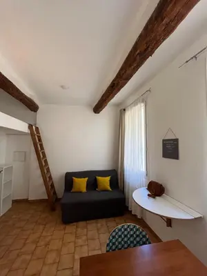 a living room with a couch and a table at Casa Centrale in Aix-en-Provence