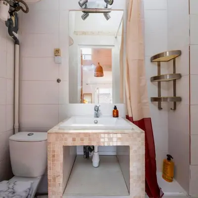 a bathroom with a sink and a toilet at Les Toits d'Aix - Hyper center - Cours Mirabeau - Lumineux in Aix-en-Provence