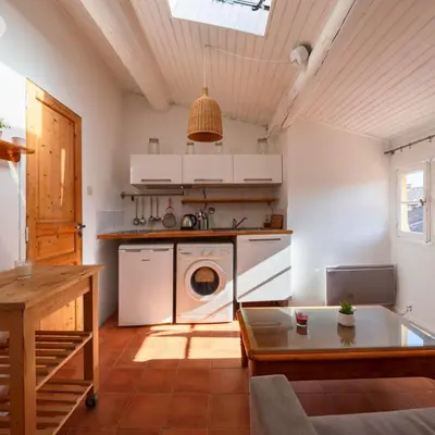 a kitchen with a washer and dryer in it at Les Toits d'Aix - Hyper center - Cours Mirabeau - Lumineux in Aix-en-Provence