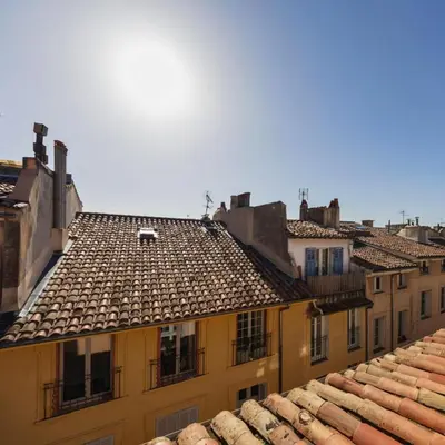 a view of roofs of buildings in a city at Les Toits d'Aix - Hyper center - Cours Mirabeau - Lumineux in Aix-en-Provence