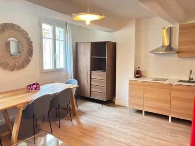 a kitchen and dining room with a table and chairs at Chez Fleur in Aix-en-Provence