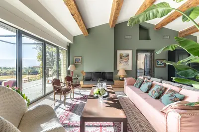 a living room with a couch and a table at Madame Luberon in Roussillon