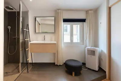 a bathroom with a sink and a mirror at Sweet Home in Aix-en-Provence