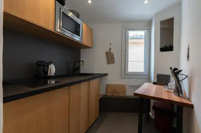 a kitchen with a sink and a counter top at Sweet Home in Aix-en-Provence