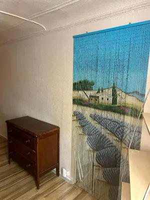 a small room with a staircase with a mirror at Chambre Centre Aix Salle de Bain privée in Aix-en-Provence