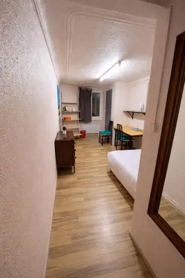 a table and two chairs in a room at Chambre Centre Aix Salle de Bain privée in Aix-en-Provence
