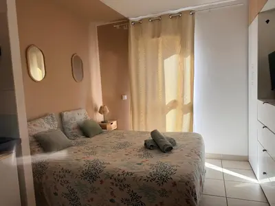 a bedroom with a bed and a window at Le Clos d'AIX studio 205 in Aix-en-Provence