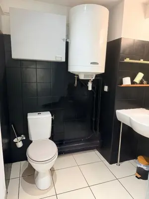 a bathroom with a white toilet and a sink at Le Clos d'AIX studio 205 in Aix-en-Provence
