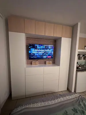 a living room with a tv on a wall at Le Clos d'AIX studio 211 in Aix-en-Provence