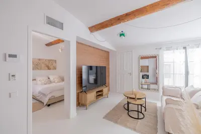 a bedroom with a bed and a tv in a room at Appartement Belle Lettre 8 in Aix-en-Provence