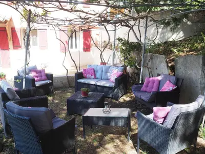 a group of chairs and couches in a yard at Holiday Home in Provence near Mont Ventoux in Bédoin