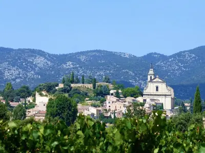 a small town on a hill with a church at Holiday Home in Provence near Mont Ventoux in Bédoin
