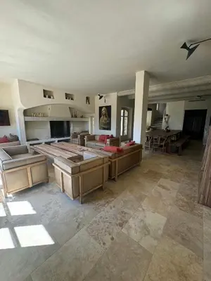 a large living room with couches and a table at Stunning Stone House With Pool Near Gordes in Gordes