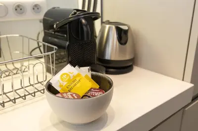 a bowl of food sitting on a counter in a kitchen at Le Zola - Studio premium hypercentre - Wifi - Climatisation in Aix-en-Provence