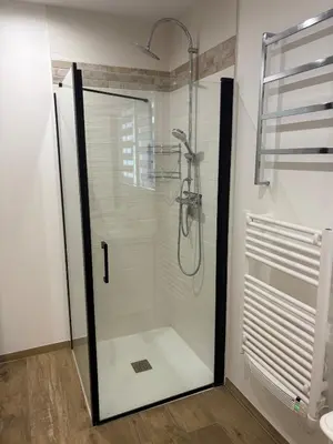 a shower with a glass door in a bathroom at Grande maison familiale tout confort in Éguilles