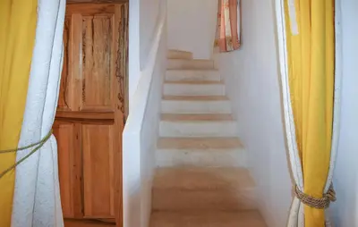 a stairway leading up to a room with a door at Pet Friendly Home In Gargas With Wifi in Gargas