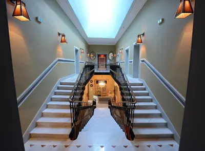 an overhead view of a staircase in a house at Grand Hôtel Henri - Teritoria in LʼIsle-sur-la-Sorgue