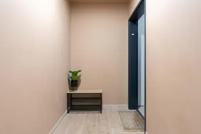 a hallway with a table and a potted plant at Le Casanelle in Aix-en-Provence