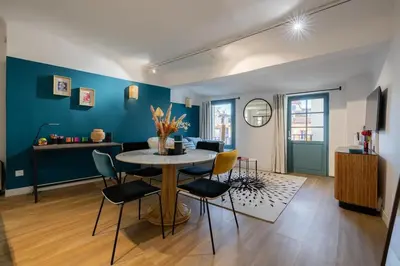 a dining room with a table and chairs at 2 rooms apartment in the city center in Aix-en-Provence